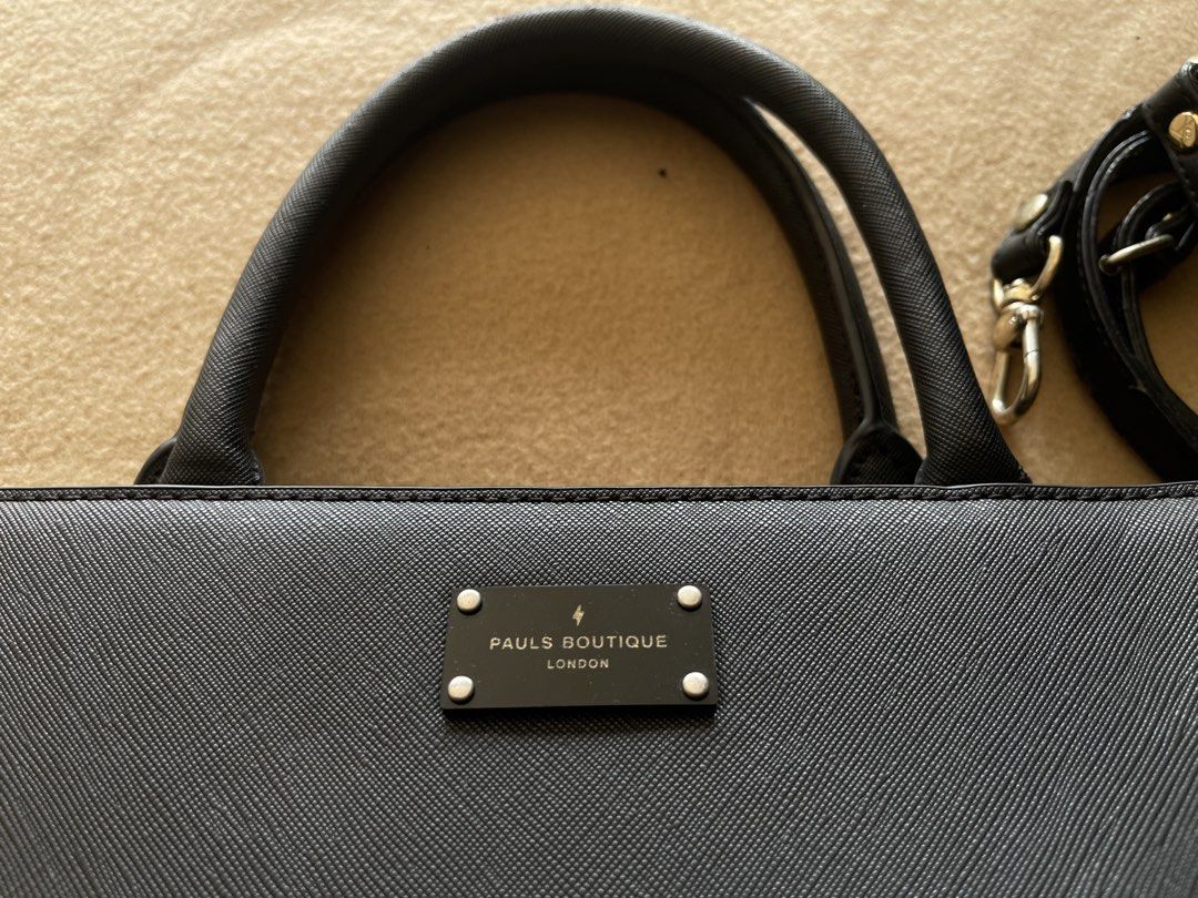 Pauls Boutique Black Office Bag (Category: Shoulder Bags) located in Imus. Submitted by cheratedfinds (Listing ID 1452312500, Image 2). Description: Authentic PAULS BOUTIQUE LONDON 2-Way Satchel / Crossbody Bag in Black Saffiano finish. - Brand: Pauls Boutique London - Color: Black - Material: 100% Polyurethane (Vegan Saffiano Leather) - Features: Signature lightning bolt interior lining, front metal logo plaque, complete with detachable long str