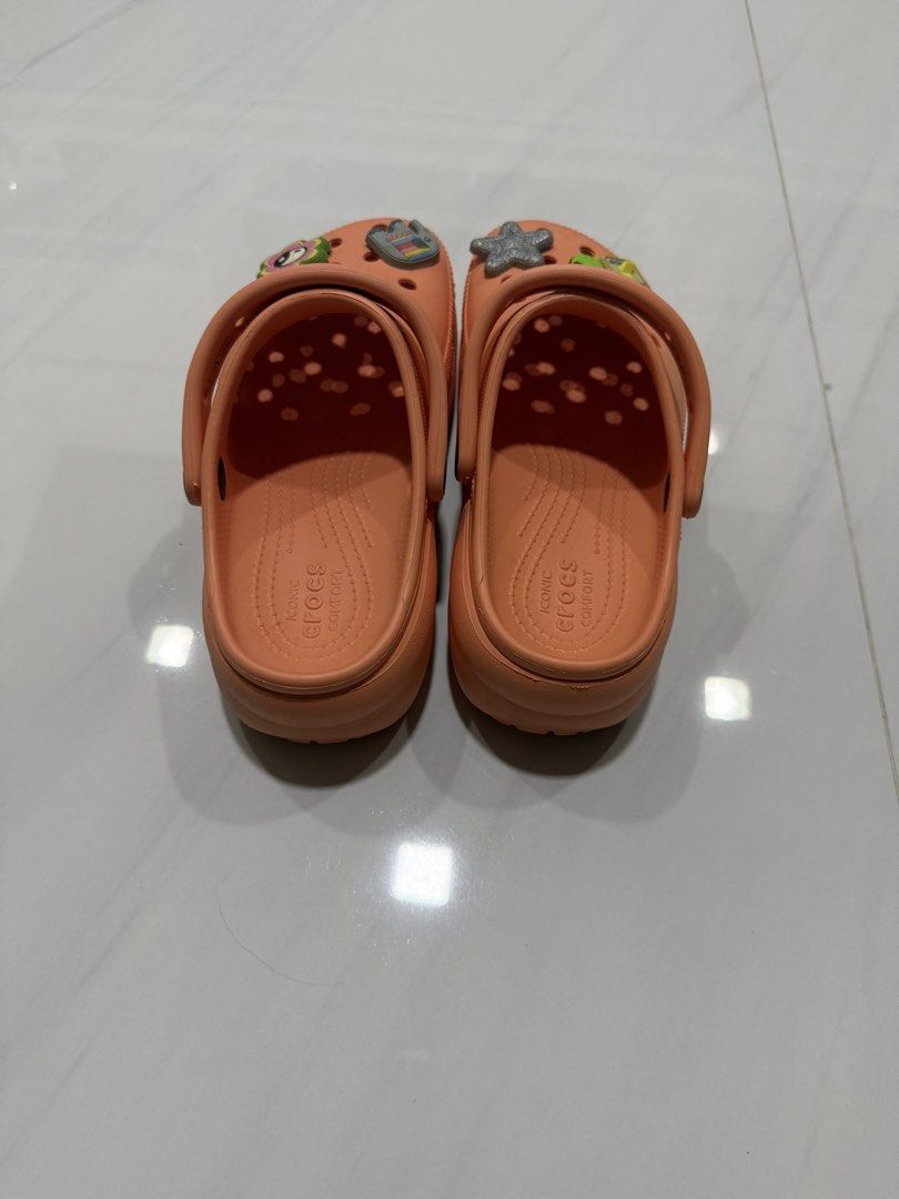 peach colored Crocs Classic Clogs (Category: Sandals) located in Balanga. Submitted by liiiizzzzzzzzz (Listing ID 1452246073, Image 3). Description: - used once - The Jibbitz shown are included for free Size: W6 / US6/ 22cm.