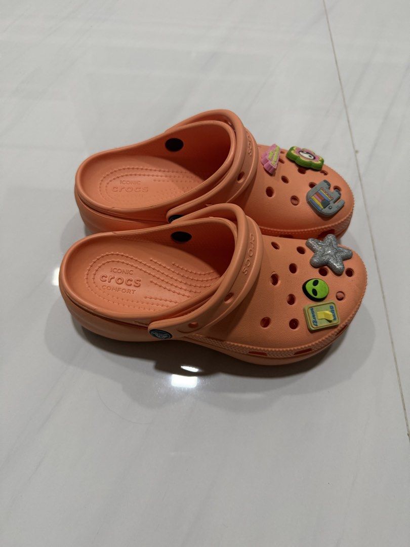 peach colored Crocs Classic Clogs (Category: Sandals) located in Balanga. Submitted by liiiizzzzzzzzz (Listing ID 1452246073, Image 2). Description: - used once - The Jibbitz shown are included for free Size: W6 / US6/ 22cm.