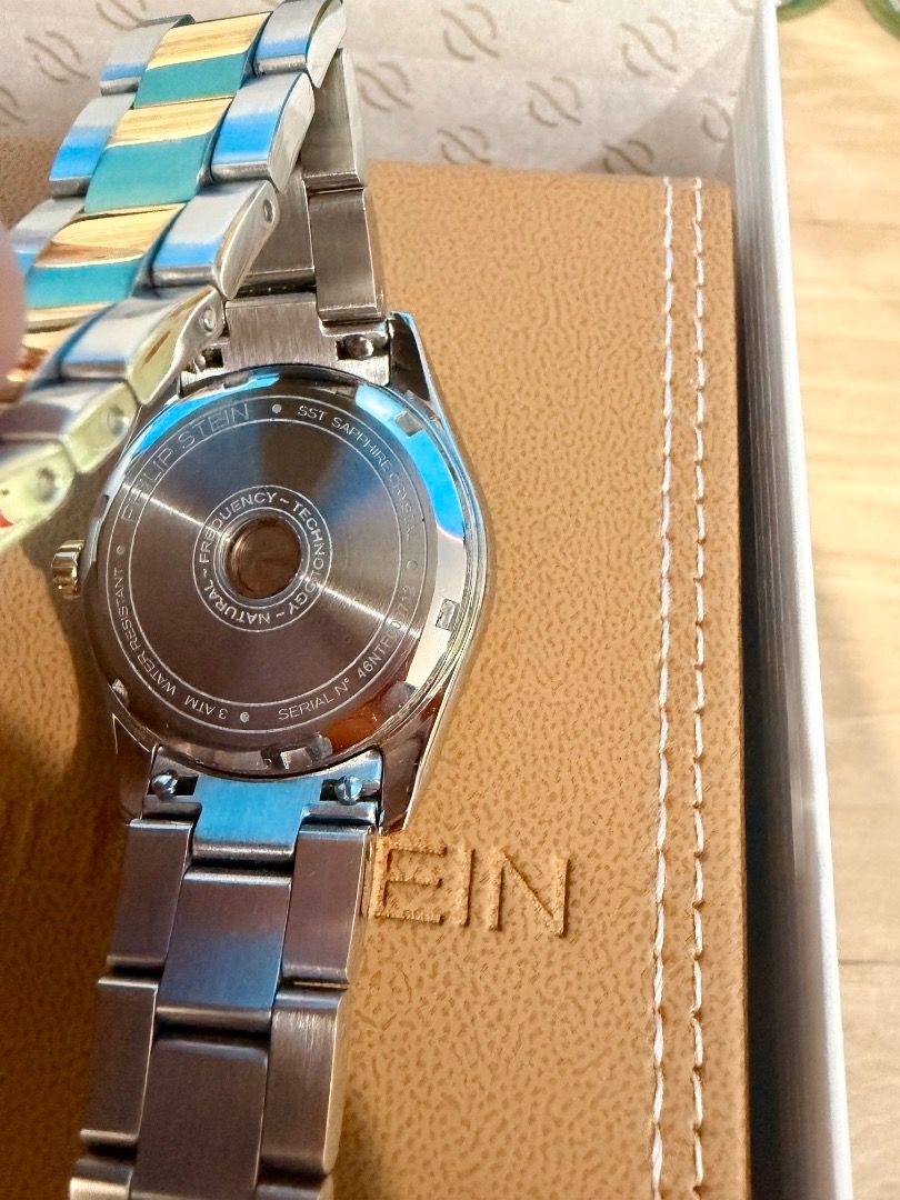 Philip Stein Watch Two-Tone Lab-Grown Diamond (Category: Luxury Watches) located in San Juan City. Submitted by william_mc_1356 (Listing ID 1452301141, Image 1). Description: - Gender: Unisex - Authentic Philip Stein Watch - Two-tone stainless steel band - Dial features lab-grown diamonds - Diamond: 10 pcs / 0.05ctw - Includes original box, certificate of authenticity, and shopping bag - Equipped with Natural Frequency Technology -Dial Color: Bla