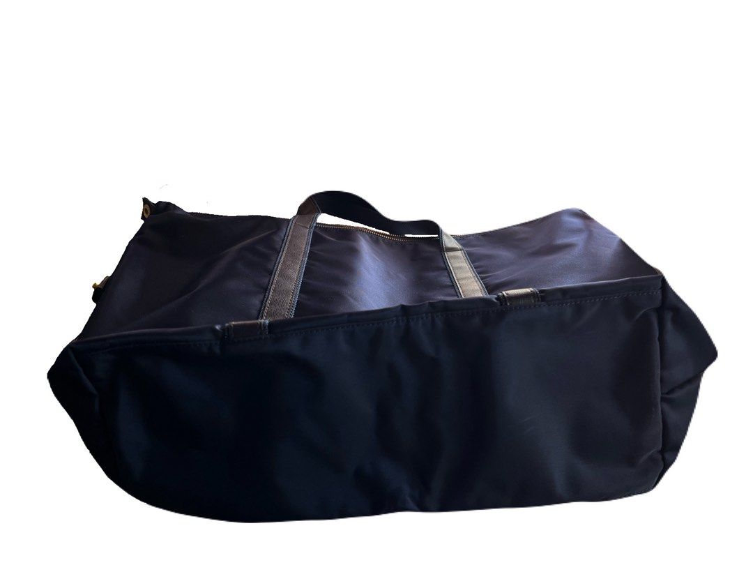 Pierre Cardin Navy Blue Tote Bag (Category: Tote Bags) located in La Trinidad. Submitted by whatnotcollections (Listing ID 1452249873, Image 3). Description: - Unisex tote bag. - Ideal for school, office, weekend getaways or gym sessions and everyday use. - Secure zipper (YKK) closure Approximately (in inches): W: 20” H: 14” Depth: 5.5” It doesn’t have fabric internal label. The lack of an inner fabric tag is actually very common for this specifi