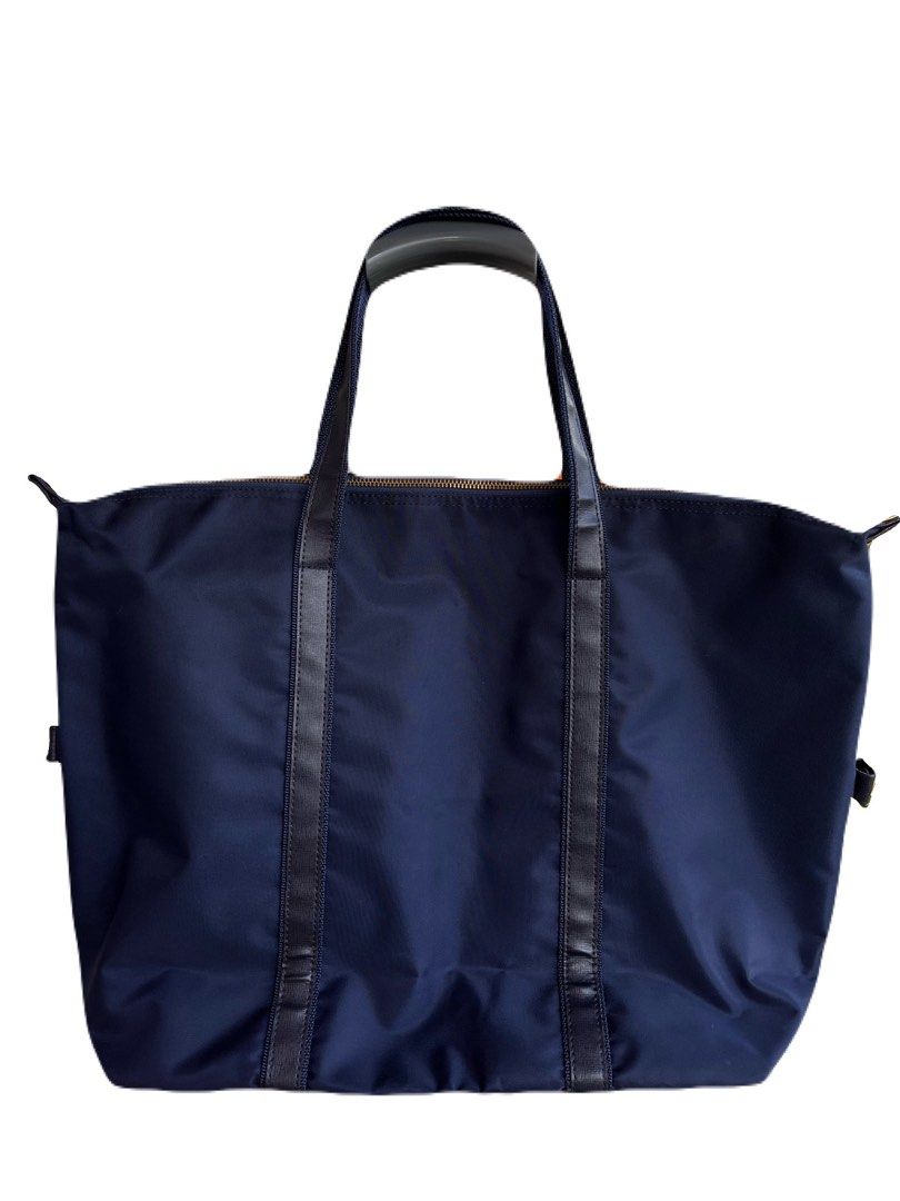 Pierre Cardin Navy Blue Tote Bag (Category: Tote Bags) located in La Trinidad. Submitted by whatnotcollections (Listing ID 1452249873, Image 2). Description: - Unisex tote bag. - Ideal for school, office, weekend getaways or gym sessions and everyday use. - Secure zipper (YKK) closure Approximately (in inches): W: 20” H: 14” Depth: 5.5” It doesn’t have fabric internal label. The lack of an inner fabric tag is actually very common for this specifi