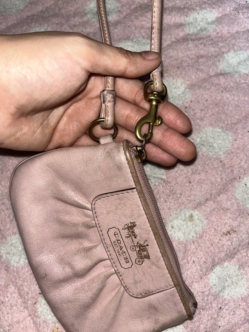 Pink Coach Wristlet With Gold Hardware (Category: Wallets & Card holders) located in Manila. Submitted by thewritelerco (Listing ID 1452254670, Image 3). Description: BUY AT YOUR OWN RISK. - Well-used. Needs intense cleaning - Coach Madison Gathered Leather Zip Clutch Wristlet 46914 - The gathered/ruched leather front - The rectangular leather patch with the old gold Coach horse-and-carriage logo - The detachable wrist strap with brass-tone hardw