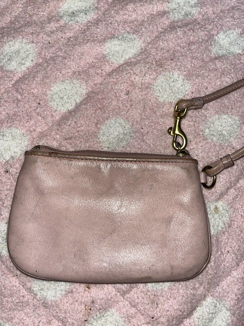 Pink Coach Wristlet With Gold Hardware (Category: Wallets & Card holders) located in Manila. Submitted by thewritelerco (Listing ID 1452254670, Image 2). Description: BUY AT YOUR OWN RISK. - Well-used. Needs intense cleaning - Coach Madison Gathered Leather Zip Clutch Wristlet 46914 - The gathered/ruched leather front - The rectangular leather patch with the old gold Coach horse-and-carriage logo - The detachable wrist strap with brass-tone hardw
