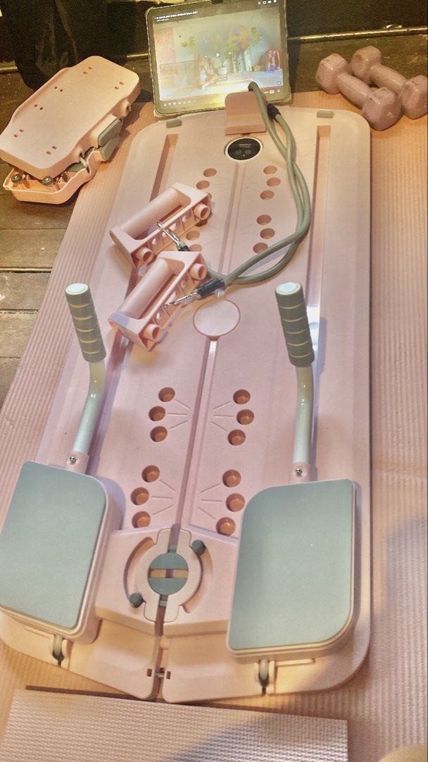 Pink Home Reformer Pilates Board (Category: Cardio & Fitness Machines) located in Calamba. Submitted by juanraphaeldilag (Listing ID 1452246145, Image 1). Description: - Pink Reformer Pilates Board perfect for home workouts. - Includes resistance bands, handles and other equipment for a full-body exercise. - Digital display tracks your workout progress. - Compact design for easy storage. - Ideal for toning legs and arms. - Yoga mat and Dumbbells 