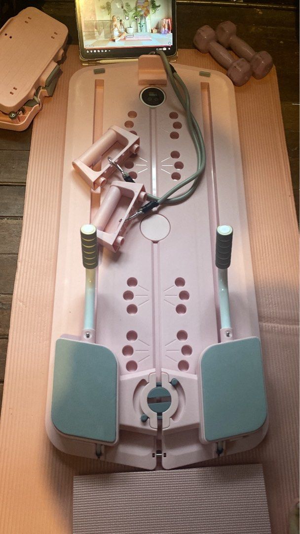 Pink Home Reformer Pilates Board (Category: Cardio & Fitness Machines) located in Calamba. Submitted by juanraphaeldilag (Listing ID 1452246145, Image 3). Description: - Pink Reformer Pilates Board perfect for home workouts. - Includes resistance bands, handles and other equipment for a full-body exercise. - Digital display tracks your workout progress. - Compact design for easy storage. - Ideal for toning legs and arms. - Yoga mat and Dumbbells 
