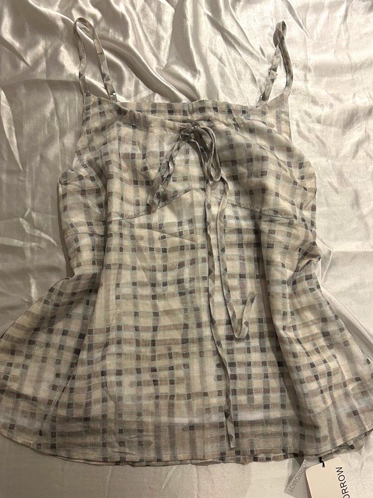 plaid blue & gray camisole top sheer lightweight (Category: Sleeveless) located in Quezon City. Submitted by sandrinasaurus (Listing ID 1452242085, Image 1). Description: free size - adjustable straps - front tie detail (can be untied) - lightweight and airy fabric - contact for exact measurements - originally purchased for ₱600 - never worn before with original tags attached 📍 quezon city 💸 gcash 📬 j&t / contact for other methods + shipping f