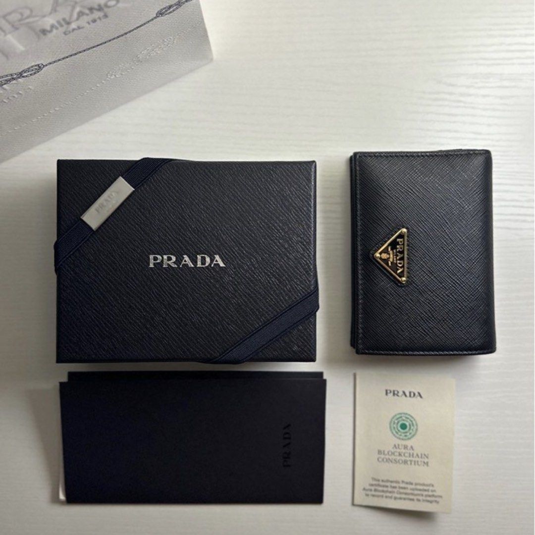 Prada Saffiano Small Leather Wallet (Black) (Category: Luxury Bags & Wallets) located in Manila. Submitted by scorpiothingz (Listing ID 1452288170, Image 3). Description: Bought for 42k Selling for 30k Condition: 9/10 Color: Nero Black - saffiano material -gold hardware (logo and zipper) -high-quality leather (water proof and scratch-resistant) -the box itself is also made out of leather -comes with authenticity card, original box, official recei