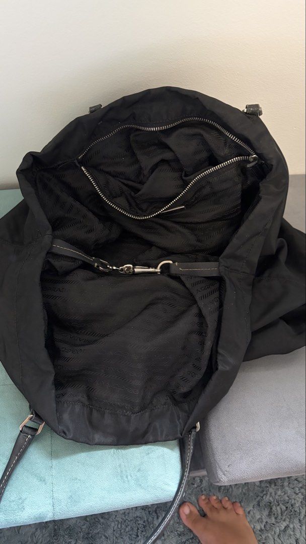 PRADA Nylon shoulder bag (Category: Luxury Bags & Wallets) located in Rizal. Submitted by happyhauls22 (Listing ID 1452180762, Image 3). Description: - Stylish black bag - Durable nylon material - Spacious interior - lightweight, classic and versatile design - minor stitching needed - my own personal bag, well maintained, newly cleaned, handle and zipper replaced by Prime Restore ( nawala na authenticity identifiers) - Still pretty and presentabl