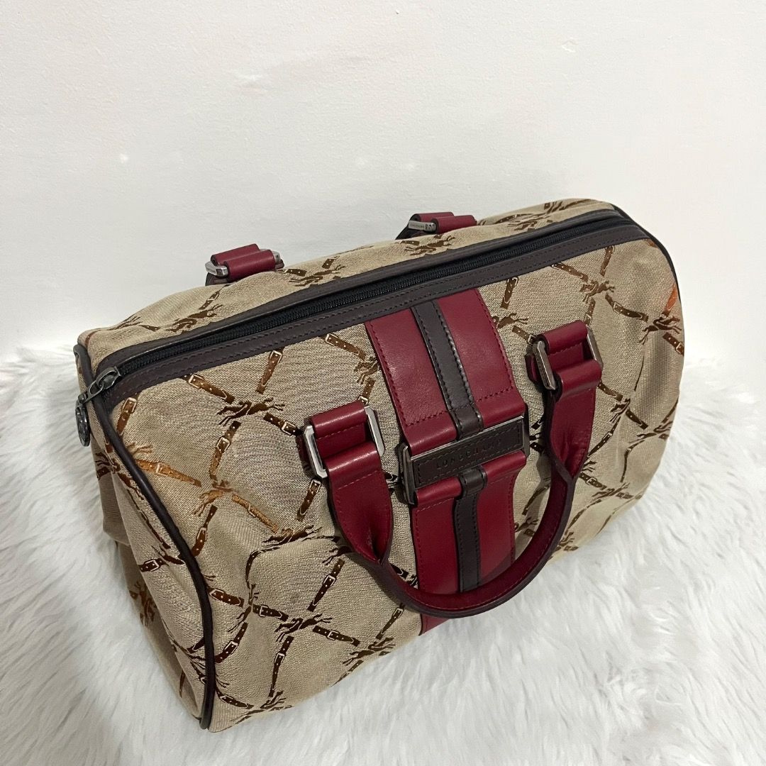 Preloved Authentic Longchamp LM Jacquard Handle Bag (Category: Luxury Bags & Wallets) located in Caloocan City. Submitted by peanutbutter23_562 (Listing ID 1452198914, Image 2). Description: Brand: Longchamp Paris Model: LM Jacquard Handle Bag Style: Boston / Bowling Bag (rectangular duffle/doctor’s bag) Material: Jacquard Canvas with Genuine Leather Trim (with center leather accent) and Handles Hardware: Silvertone with engraved “Longchamp” Aver