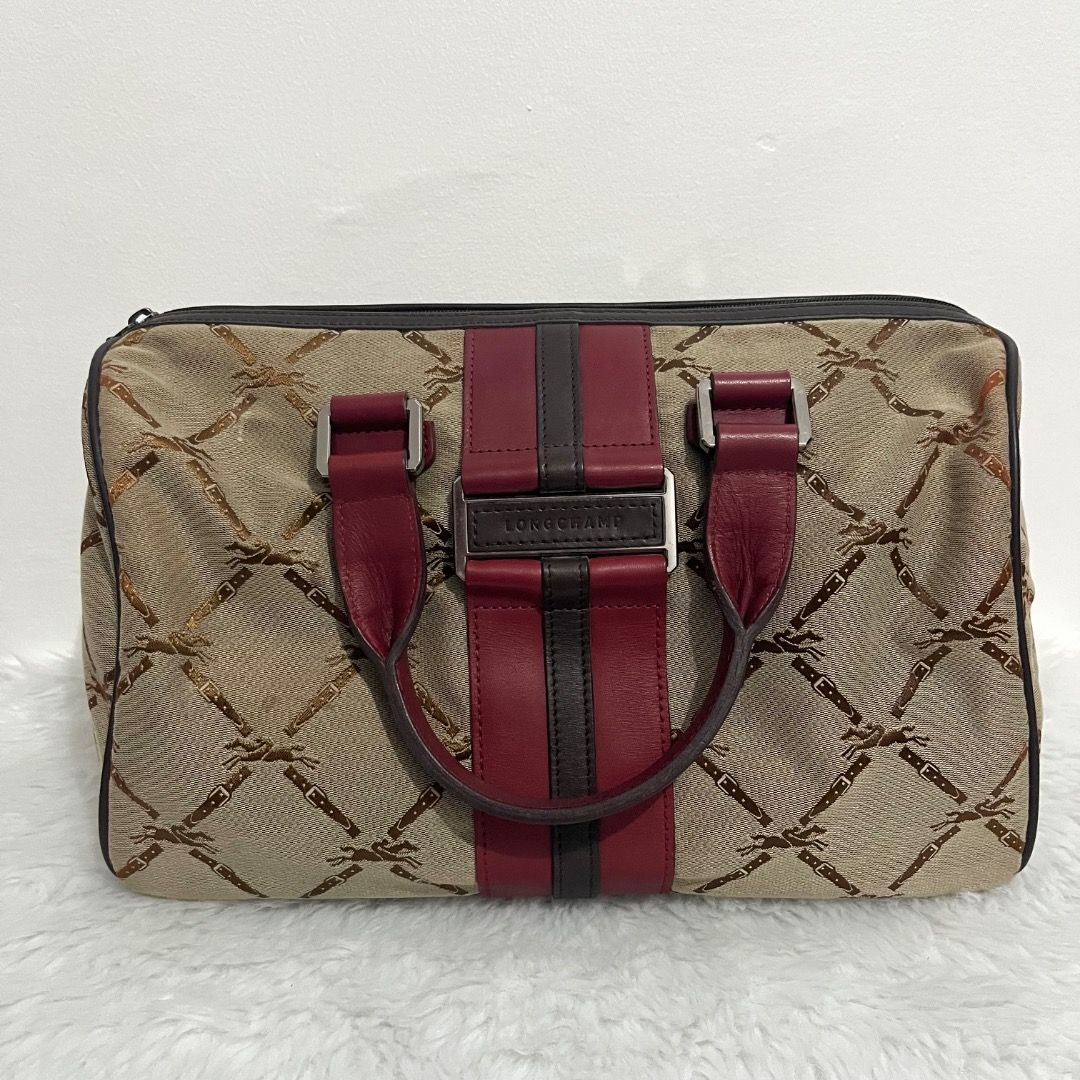Preloved Authentic Longchamp LM Jacquard Handle Bag (Category: Luxury Bags & Wallets) located in Caloocan City. Submitted by peanutbutter23_562 (Listing ID 1452198914, Image 1). Description: Brand: Longchamp Paris Model: LM Jacquard Handle Bag Style: Boston / Bowling Bag (rectangular duffle/doctor’s bag) Material: Jacquard Canvas with Genuine Leather Trim (with center leather accent) and Handles Hardware: Silvertone with engraved “Longchamp” Aver