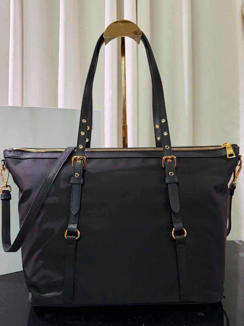 Preloved Prada Tessuto Nylon Saffiano Tote (Category: Luxury Bags & Wallets) located in Manila. Submitted by bagsandshoesmanymore (Listing ID 1372170624, Image 3). Description: Preloved Prada Tessuto Size L 14” x H 12” Good condition Rank SA JAPAN PRELOVED Lampo zipper Please read before you order 👉🏻❗️Payment first before shipping ❗️Cut off time of payment 11am sameday delivery ❗️NO MEET UP / NO PICK UP ❗️ORDER CANNOT BE CANCELLED ❗️PLEASE DON’
