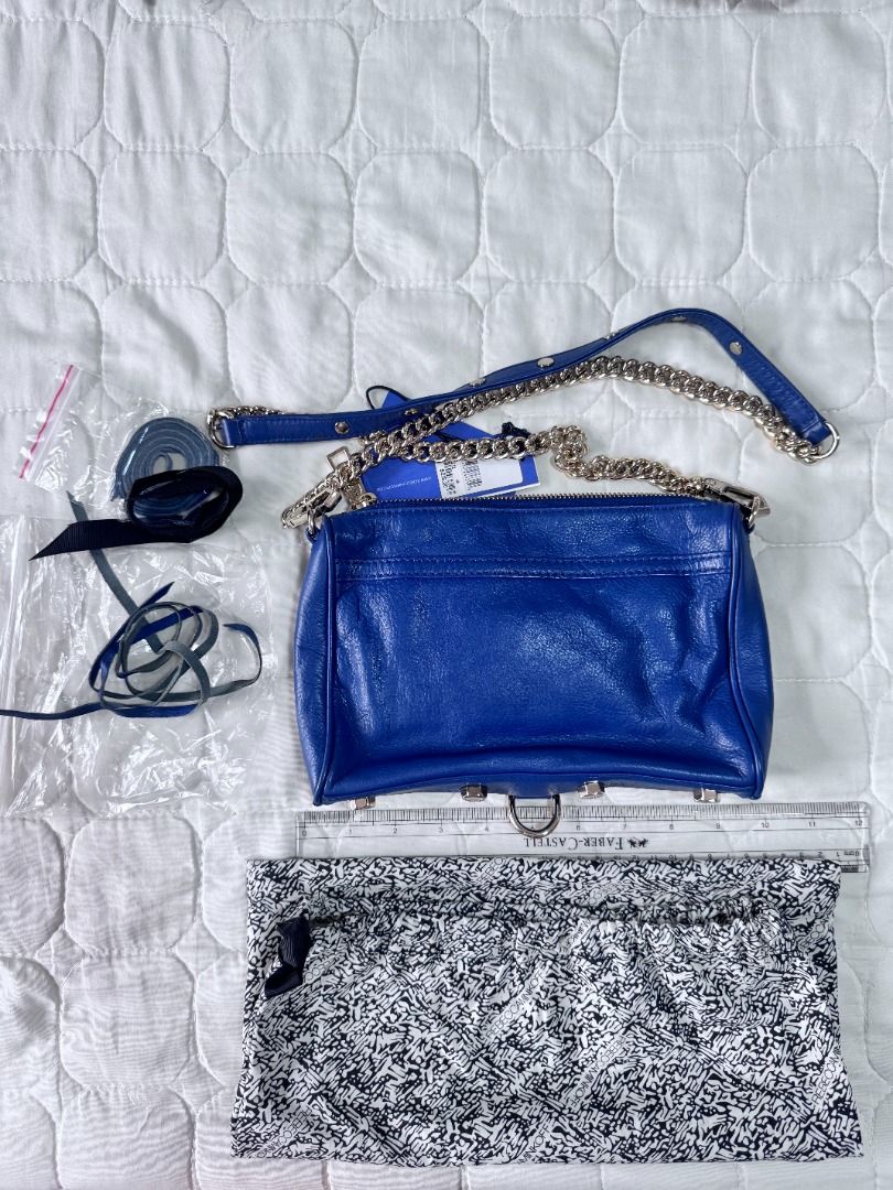 Rebecca Minkoff Navy Mini MAC Complete (Category: Luxury Bags & Wallets) located in Makati City. Submitted by mbrtom (Listing ID 1452180089, Image 3). Description: Purchased in the US. Complete with tags and dustbag. Slight stains inside zipper area. Very nice soft leather and shade of blue /periwinkle. Unused tassles included. .