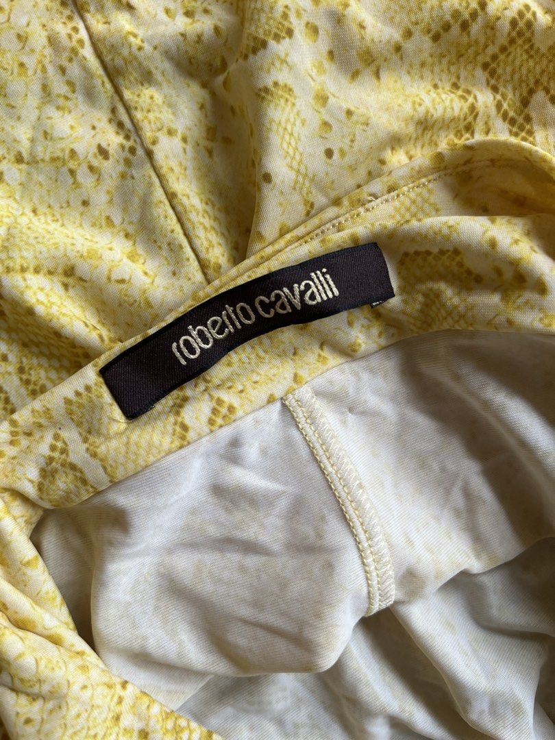 Roberto Cavalli Yellow Snake Print Halter Top (Category: Sleeveless) located in Makati City. Submitted by slavetorave (Listing ID 1452152003, Image 3). Description: - yellow halter top with snake print. - flattering ruching detail at the bust. - Adjustable tie halter neck for a customized fit. - Comfortable stretch fabric made from polyamide and elastane. - Size 40IT.
