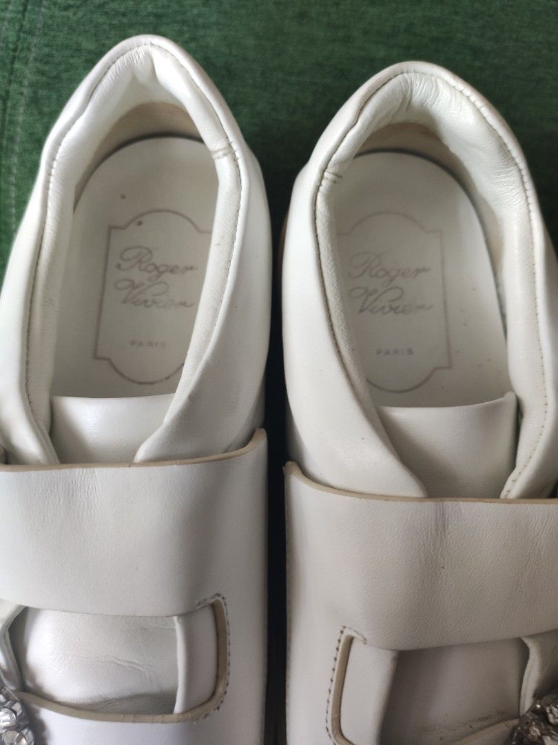 Roger Vivier White Leather Crystal Buckle Sneakers (Category: Sneakers) located in Paranaque City. Submitted by daddyu (Listing ID 1452289521, Image 3). Description: - White leather sneakers - Signature crystal buckle detail - Slip-on style with velcro straps - Comfortable platform sole - Made in Italy - Minor signs of wear on soles and leather.