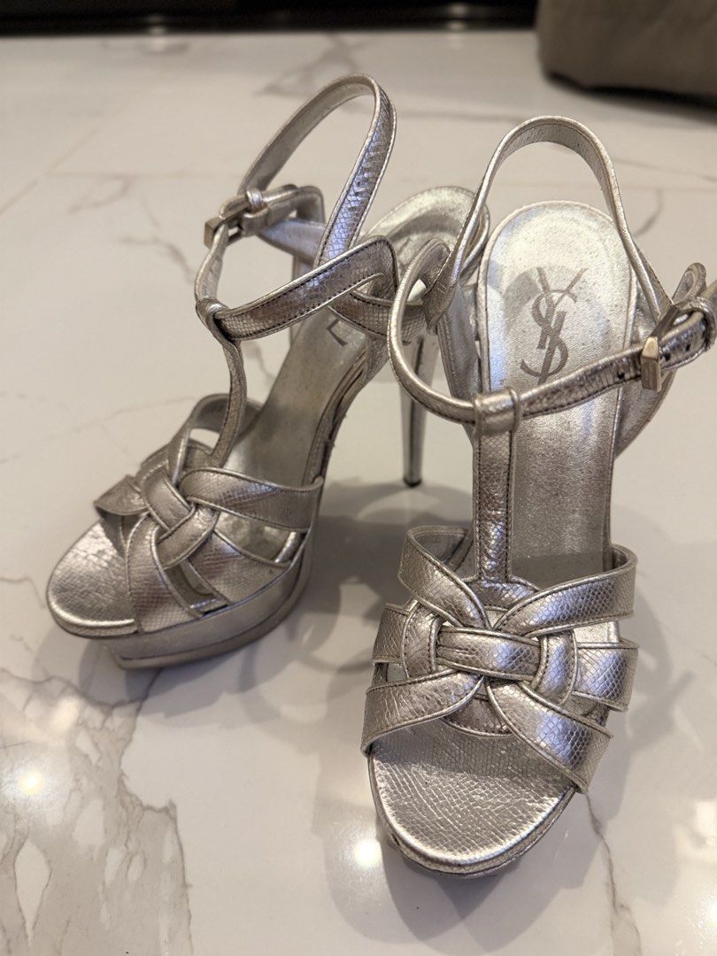 Saint Laurent Silver Tribute Platform Sandals (Category: Heels) located in Quezon City. Submitted by chriz_m (Listing ID 1452239944, Image 2). Description: - Authentic Saint Laurent Tribute platform sandals - Color: Silver - Size: 36 - Condition: Pre-loved, with visible scuffing on soles and heels - Features adjustable straps - Ideal for dressing up outfits.