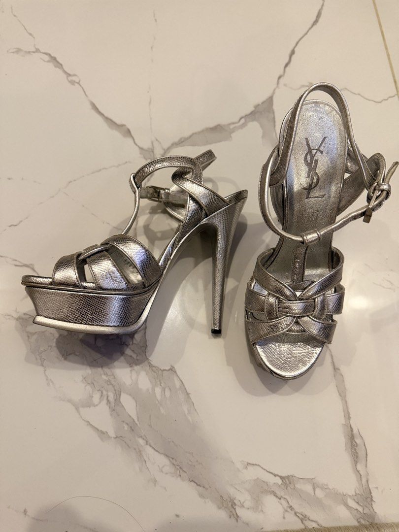Saint Laurent Silver Tribute Platform Sandals (Category: Heels) located in Quezon City. Submitted by chriz_m (Listing ID 1452239944, Image 3). Description: - Authentic Saint Laurent Tribute platform sandals - Color: Silver - Size: 36 - Condition: Pre-loved, with visible scuffing on soles and heels - Features adjustable straps - Ideal for dressing up outfits.