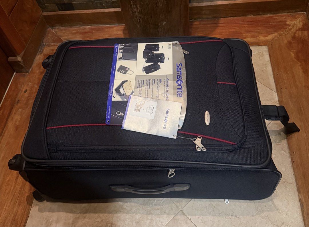 Samsonite 4-Piece Luggage Set - Navy Blue (Category: Luggage) located in Pasig City. Submitted by danbrit_sells (Listing ID 1452159923, Image 3). Description: - Samsonite 4-piece luggage set - Color: Navy blue with red trim - Includes: Large suitcase, carry-on, and two smaller bags - Features: Wheels and retractable handles on all pieces - Ideal for: Family trips or extended travel - Condition: New with original tags and packaging.