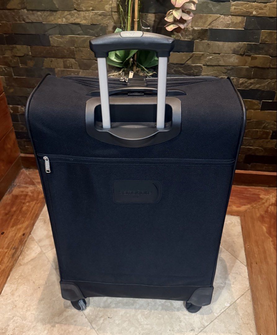 Samsonite 4-Piece Luggage Set - Navy Blue (Category: Luggage) located in Pasig City. Submitted by danbrit_sells (Listing ID 1452159923, Image 2). Description: - Samsonite 4-piece luggage set - Color: Navy blue with red trim - Includes: Large suitcase, carry-on, and two smaller bags - Features: Wheels and retractable handles on all pieces - Ideal for: Family trips or extended travel - Condition: New with original tags and packaging.