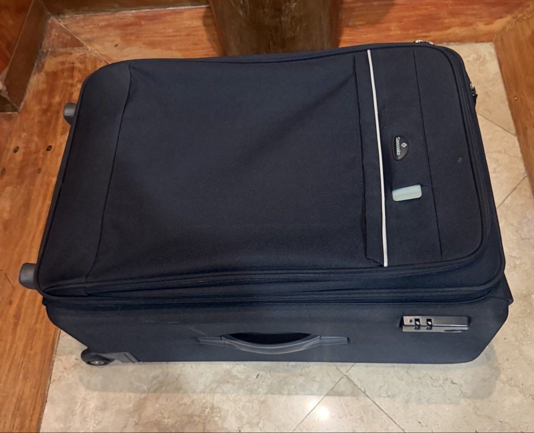 Samsonite Expandable Spinner Luggage (Category: Luggage) located in Pasig City. Submitted by danbrit_sells (Listing ID 1452160038, Image 3). Description: - Dark blue Samsonite luggage - Expandable for extra packing space - Built-in combination lock for security - Smooth-rolling wheels - Spacious, lined interior - Ideal for travel and adventures.