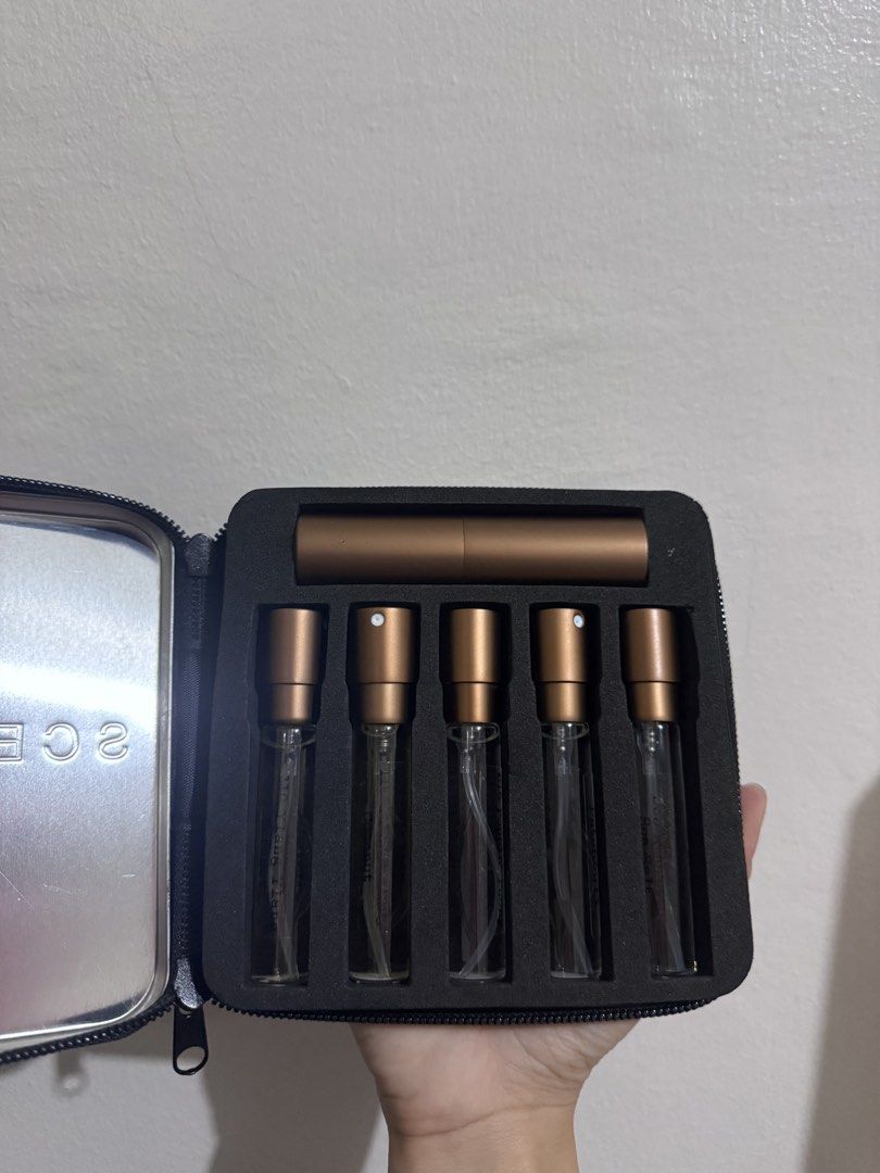SCENTSMITH Perfumery Discovery Set (Category: Fragrance & Deodorants) located in Manila. Submitted by brbdecluttering (Listing ID 1452303193, Image 2). Description: - SCENTSMITH Perfumery travel perfume sampler set - Includes travel atomizer and 5 perfume vials - Brown case with zipper closure - Ideal for trying different scents on the go - Compact and easy to carry 2 Ylang Ylang 1 Patchouli 1 Poppin Peonies 1 Sea Salt Amber.