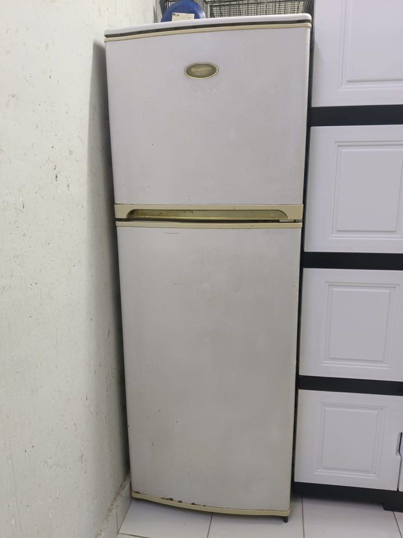 Sharp Refrigerator (Category: Refrigerators & Freezers) located in Petaling Jaya. Submitted by hafizierosli (Listing ID 1452139313, Image 2). Description: - Sharp refrigerator in good working condition. - Features a convenient chilled compartment. - Includes a dedicated egg pocket for storage. - Adjustable temperature control for optimal cooling. - Minor cosmetic scuffs on the exterior. - Interior requires a thorough cleaning. - A reliable and fu