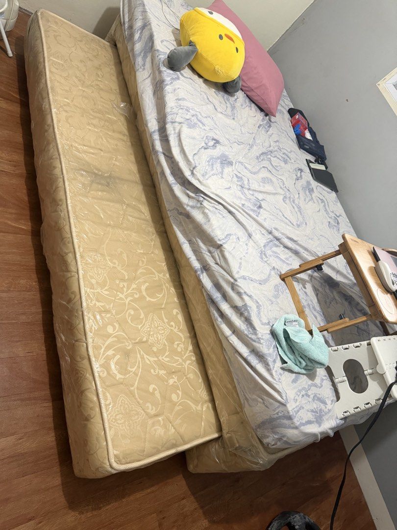 Single Mattress with Pull out bed (Category: Bed Frames & Mattresses) located in Las Pinas. Submitted by bianchee (Listing ID 1452149349, Image 2). Description: - Mattress with blue and white patterned sheet - Light beige bed base - Ready for a new home - Pickup only.