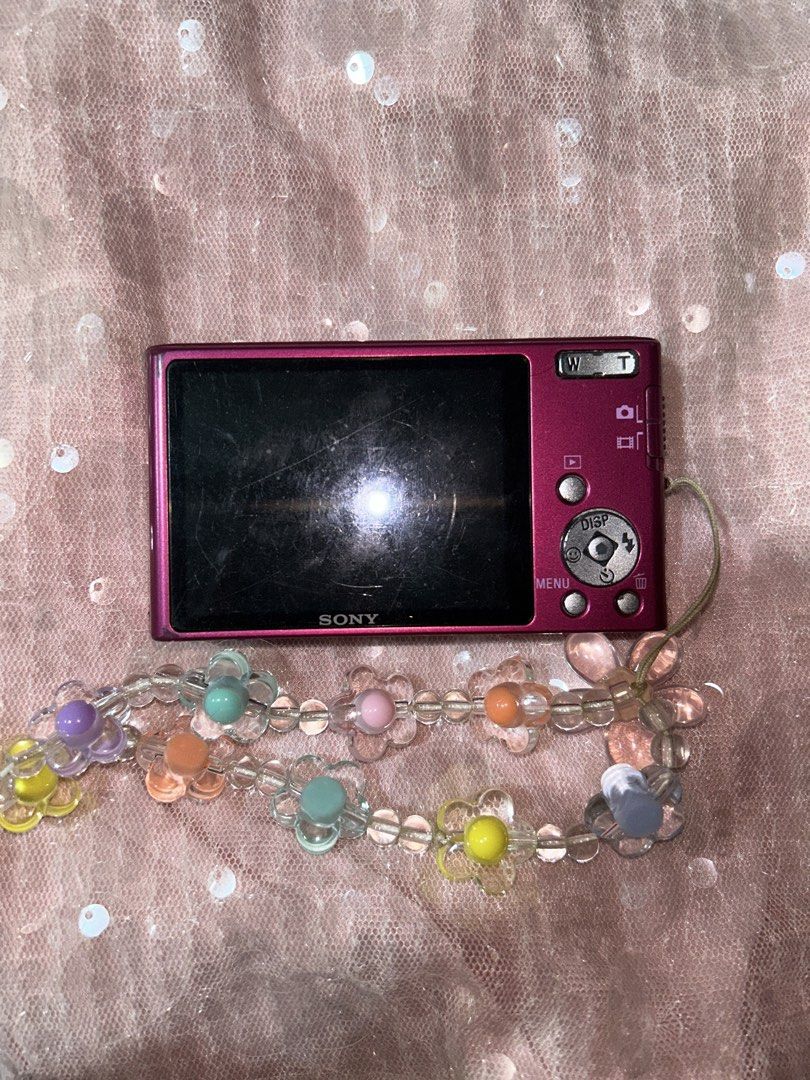 Sony Cyber-shot DSC-W320 Pink Digital Camera (Category: Cameras) located in Quezon City. Submitted by jaqelyn (Listing ID 1452222894, Image 3). Description: - Pink Sony Cyber-shot camera - 14.1 Megapixels - 4x Optical Zoom - SteadyShot Image Stabilization - Comes with a cute beaded flower strap - Ideal for quick snaps and everyday use Preloved Digicam Pink Sony Cybershot DSC-W320 ₱6,800 Features: 14.1 Megapixels All buttons working Flash working 