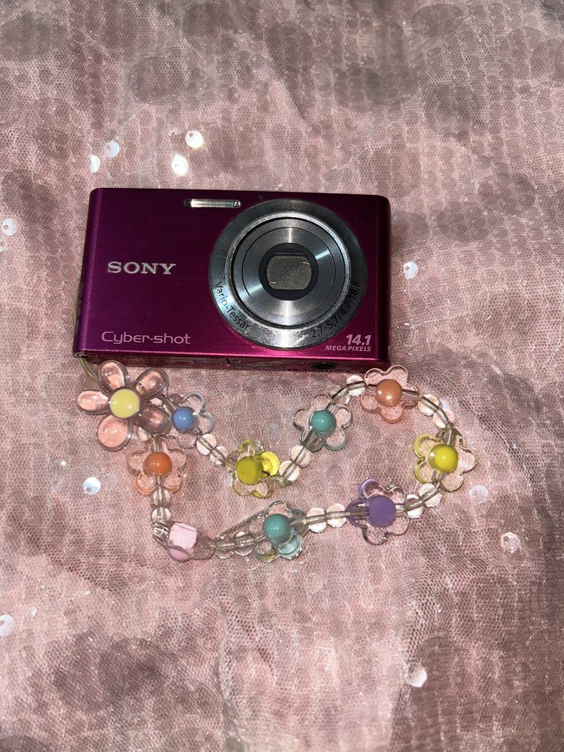 Sony Cyber-shot DSC-W320 Pink Digital Camera (Category: Cameras) located in Quezon City. Submitted by jaqelyn (Listing ID 1452222894, Image 2). Description: - Pink Sony Cyber-shot camera - 14.1 Megapixels - 4x Optical Zoom - SteadyShot Image Stabilization - Comes with a cute beaded flower strap - Ideal for quick snaps and everyday use Preloved Digicam Pink Sony Cybershot DSC-W320 ₱6,800 Features: 14.1 Megapixels All buttons working Flash working 