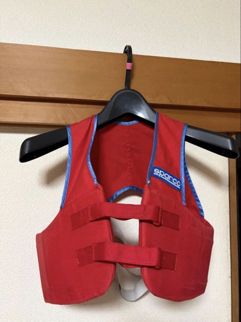 Sparco Red Life Vest (Category: Vests) located in Digos. Submitted by reywearfinds (Listing ID 1452132908, Image 1). Description: - Sparco Life Vest - Color: Red with Blue Trim - Features: Adjustable straps with velcro closure - Ideal for: Water sports and boating - Condition: Please check photos for details - Inquiries: Feel free to ask questions.