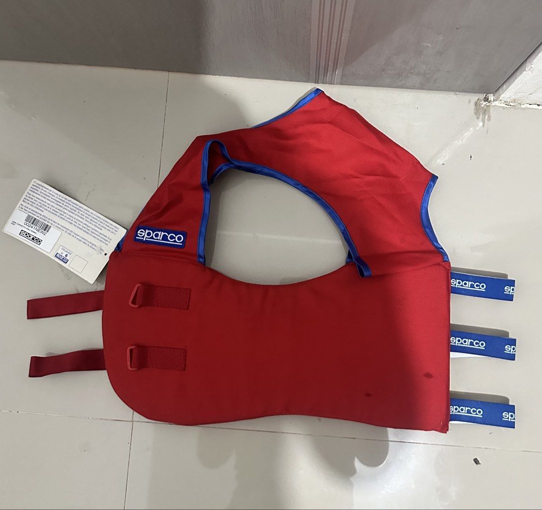 Sparco Red Life Vest (Category: Vests) located in Digos. Submitted by reywearfinds (Listing ID 1452132908, Image 3). Description: - Sparco Life Vest - Color: Red with Blue Trim - Features: Adjustable straps with velcro closure - Ideal for: Water sports and boating - Condition: Please check photos for details - Inquiries: Feel free to ask questions.