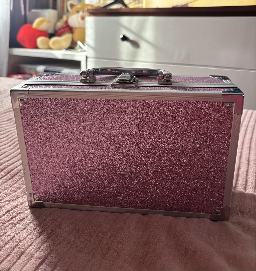 Sparkly Pink Glitter Makeup Train Case with Handle (Category: Makeup) located in Imus. Submitted by preloved_by_chlea (Listing ID 1452320235, Image 3). Description: - Cute sparkly pink glitter train case - Sturdy silver handle and latches - Ideal for storing makeup, jewelry, or small accessories - Compact and easy to carry - Perfect for travel or everyday organization.