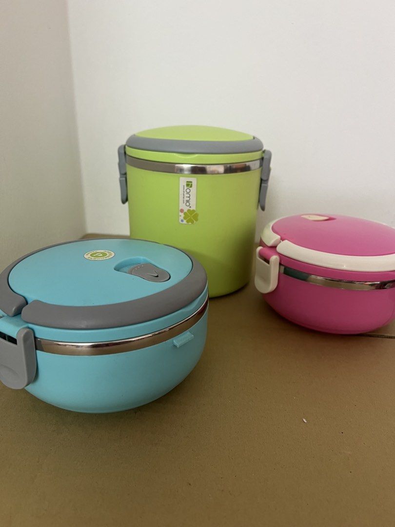 Stackable Insulated Lunch Boxes (Category: Food Organisation & Storage) located in Puchong. Submitted by mickeymouse_collections (Listing ID 1452200919, Image 3). Description: Selling stackable lunch boxes. Comes in bright colors: lime green, light blue, and pink. The lime green one is taller and cylindrical. The other three are round and stackable. Stainless steel interior. Great for packing meals on the go..