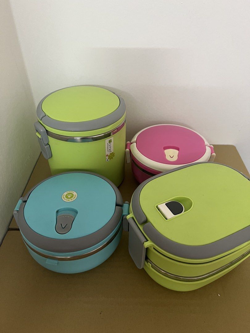 Stackable Insulated Lunch Boxes (Category: Food Organisation & Storage) located in Puchong. Submitted by mickeymouse_collections (Listing ID 1452200919, Image 1). Description: Selling stackable lunch boxes. Comes in bright colors: lime green, light blue, and pink. The lime green one is taller and cylindrical. The other three are round and stackable. Stainless steel interior. Great for packing meals on the go..