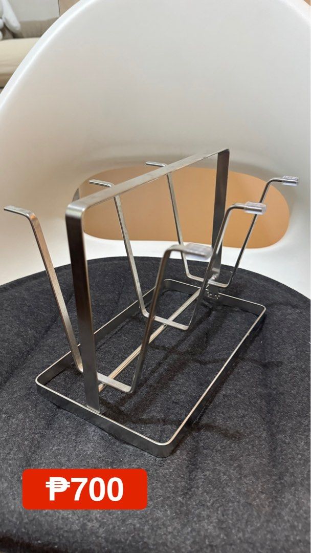Stainless Steel Drinking Glass Rack for Kitchen Countertop (Category: Other Kitchenware & Tableware) located in San Mateo. Submitted by drewmad (Listing ID 1452296348, Image 2). Description: - Durable stainless steel construction - Shiny, attractive finish - Rectangular base with multiple slots for dishes - Keeps plates and cups organized and tidy - Easy to clean and maintain - Perfect for organizing your kitchen sink area.