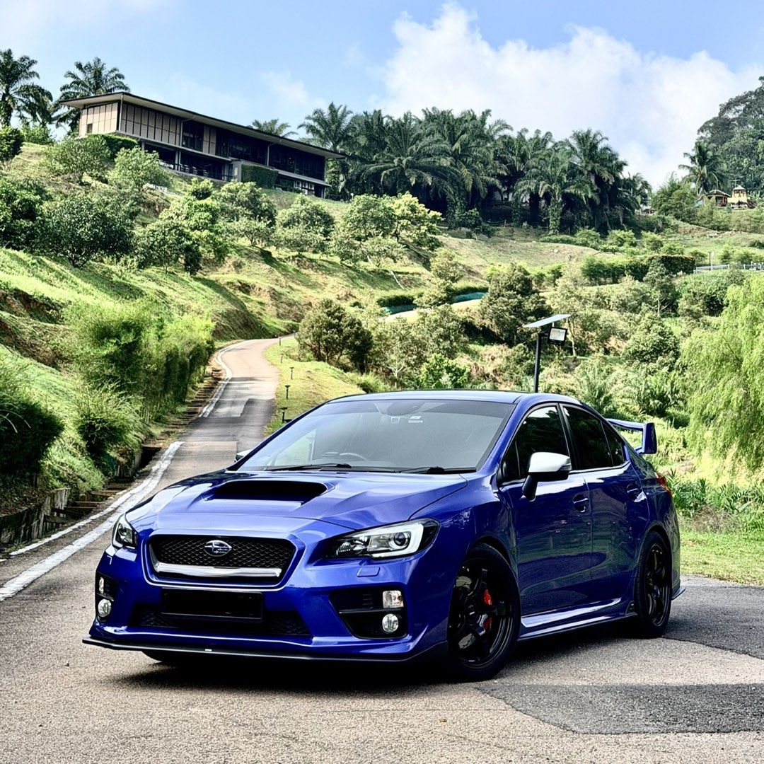 Subaru WRX 2.0 (A) (Category: Used Cars) located in Singapore. Submitted by okcoolstory (Listing ID 1451446867, Image 1). Description: Blue Subaru WRX 2.0A CVT. 2025 Rays Black rims with Inspeed brake calipers. Wear and tear all done up. Great condition, well maintained. Unwilling sale so not in a rush. No need consignment and dealers only if can meet stated price. 1) (dekitted) Invidia Exhaust with LTA Certificate 2) Force Charge Pipe 3) Force T