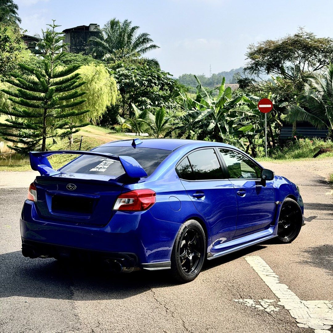 Subaru WRX 2.0 (A) (Category: Used Cars) located in Singapore. Submitted by okcoolstory (Listing ID 1451446867, Image 2). Description: Blue Subaru WRX 2.0A CVT. 2025 Rays Black rims with Inspeed brake calipers. Wear and tear all done up. Great condition, well maintained. Unwilling sale so not in a rush. No need consignment and dealers only if can meet stated price. 1) (dekitted) Invidia Exhaust with LTA Certificate 2) Force Charge Pipe 3) Force T
