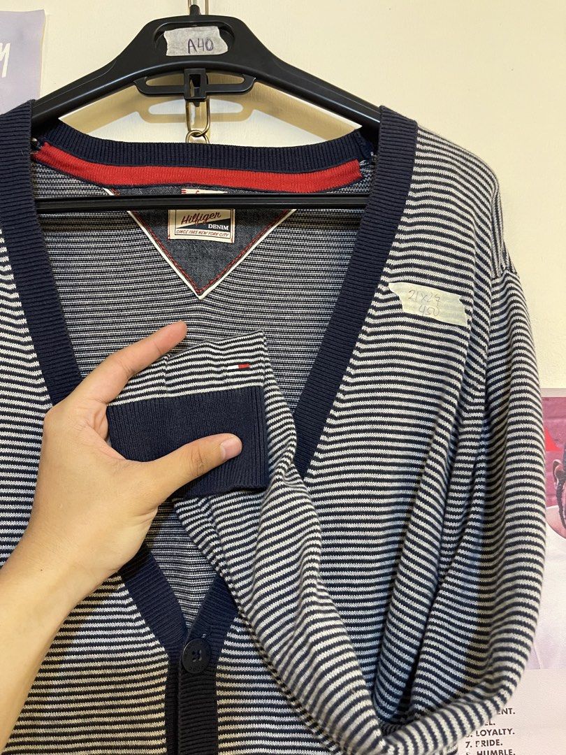 Tommy Hilfiger Denim Striped Cardigan (Category: Coats, Jackets and Outerwear) located in Tayabas. Submitted by stashsurplusph (Listing ID 1452310751, Image 2). Description: - Navy and white striped cardigan - Brand: Tommy Hilfiger Denim - V-neck with button-up front - Features a small chest pocket - Ribbed cuffs and hem - Ideal for layering over any outfit.