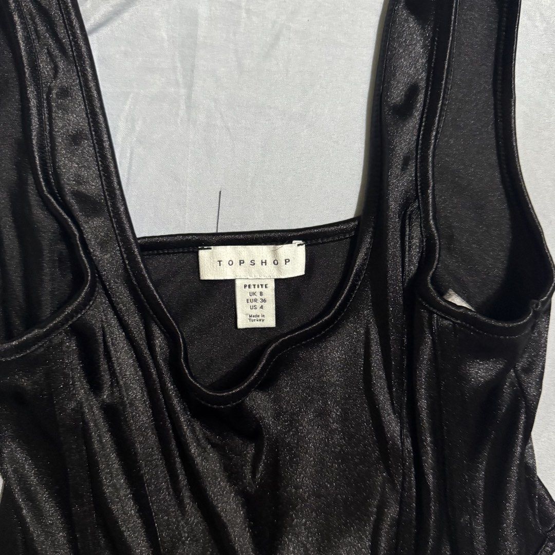 Topshop Black Corset Style Top Size 4 (Category: Sleeveless) located in Aloran. Submitted by kheyx (Listing ID 1452226160, Image 2). Description: - Topshop Petite Black Corset Style Top - Size: 4 - Material: Silky fabric - Versatile: Perfect for dressing up or down - Style: Comfortable and stylish, ideal for nights out or casual looks.