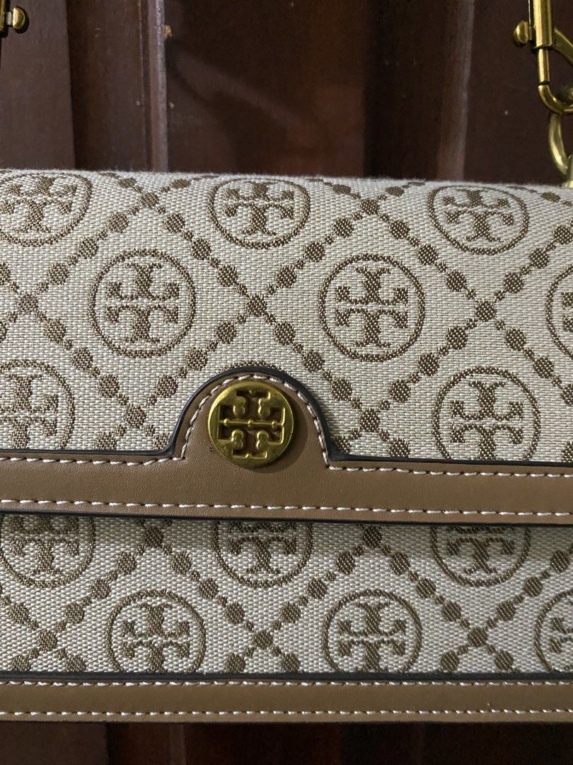 Tory Burch Monogram Shoulder Bag (Category: Luxury Bags & Wallets) located in Baguio. Submitted by karent3000 (Listing ID 1452267008, Image 2). Description: Mirror, made in Vietnam - Classic Tory Burch shoulder bag - Signature all-over monogram print - Tan leather trim and strap - Gold hardware details - Stylish everyday bag - Great for carrying essentials RFS decluttering RFS: .