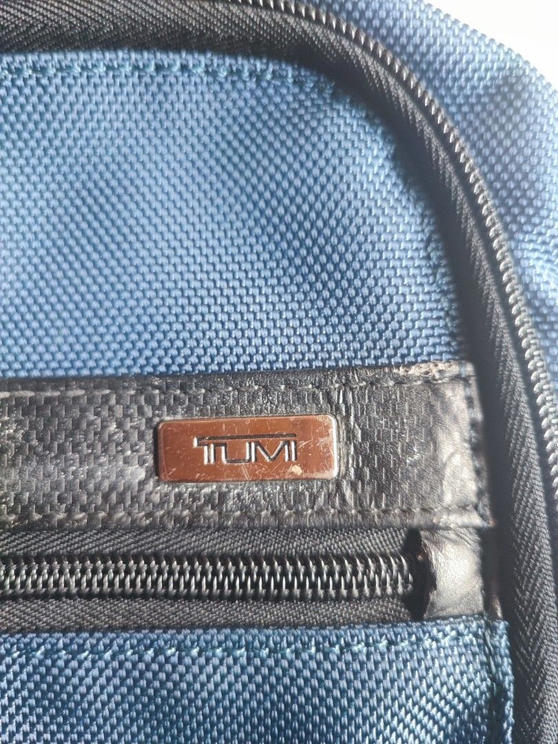 Tumi Backpack Blue Nylon Leather Trim (Category: Luxury Bags & Wallets) located in Talacogon. Submitted by mr1070 (Listing ID 1452254323, Image 3). Description: - Genuine blue Tumi backpack - Crafted from durable nylon with premium leather accents - Multiple compartments for excellent organization - Padded shoulder straps ensure maximum comfort - Ideal for both travel adventures and everyday commutes - Shows some signs of wear, but remains in goo