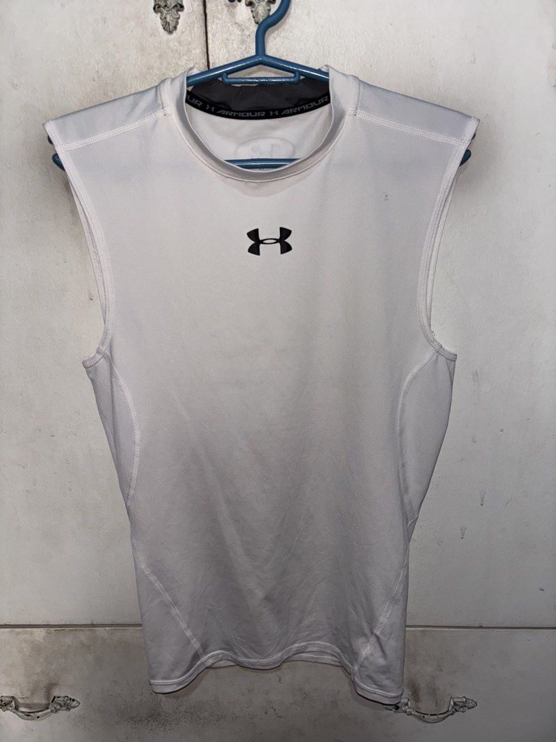 Under Armour Compression Sleeveless (Category: Activewear) located in Pasig City. Submitted by timmybatoon (Listing ID 1452173027, Image 1). Description: Under Armour Compression Sleeveless Size on tag: M Dimensions: 16inW x 24inL Price: 700 .