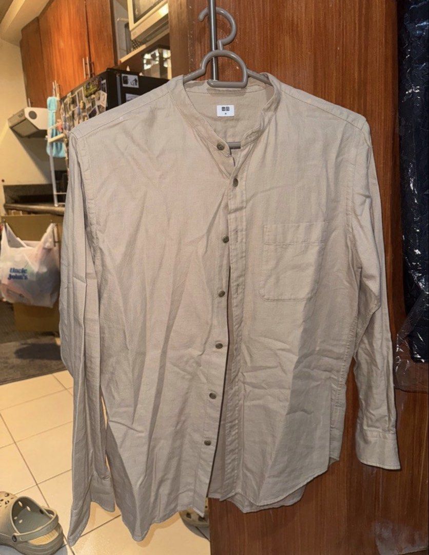 Uniqlo Mandarin Collar Long Sleeve Shirt Size M (Category: Tshirts & Polo Shirts ) located in Manila. Submitted by ianventory (Listing ID 1452257755, Image 2). Description: - Uniqlo Long Sleeve Shirt - Mandarin Collar - Button-up Front - Chest Pocket - Color: Light Beige/Tan - Size: Medium (M) - Ideal for Casual Wear.