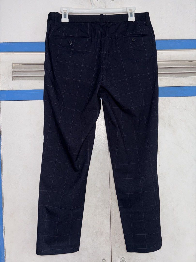 Uniqlo Men's Navy Checkered Pants Size L (Category: Trousers) located in Pasig City. Submitted by timmybatoon (Listing ID 1452317821, Image 2). Description: Uniqlo EZY Ankle Pants (Navy Blue Checkered) Size on tag: L Dimensions: 32-36inW x 37inL Price: 800 - Uniqlo Navy Checkered Pants - Size: Large (L) - Features: Elastic waistband with drawstring for adjustable comfort - Style: Perfect for casual or smart-casual outfits - Material: Blend of Ray