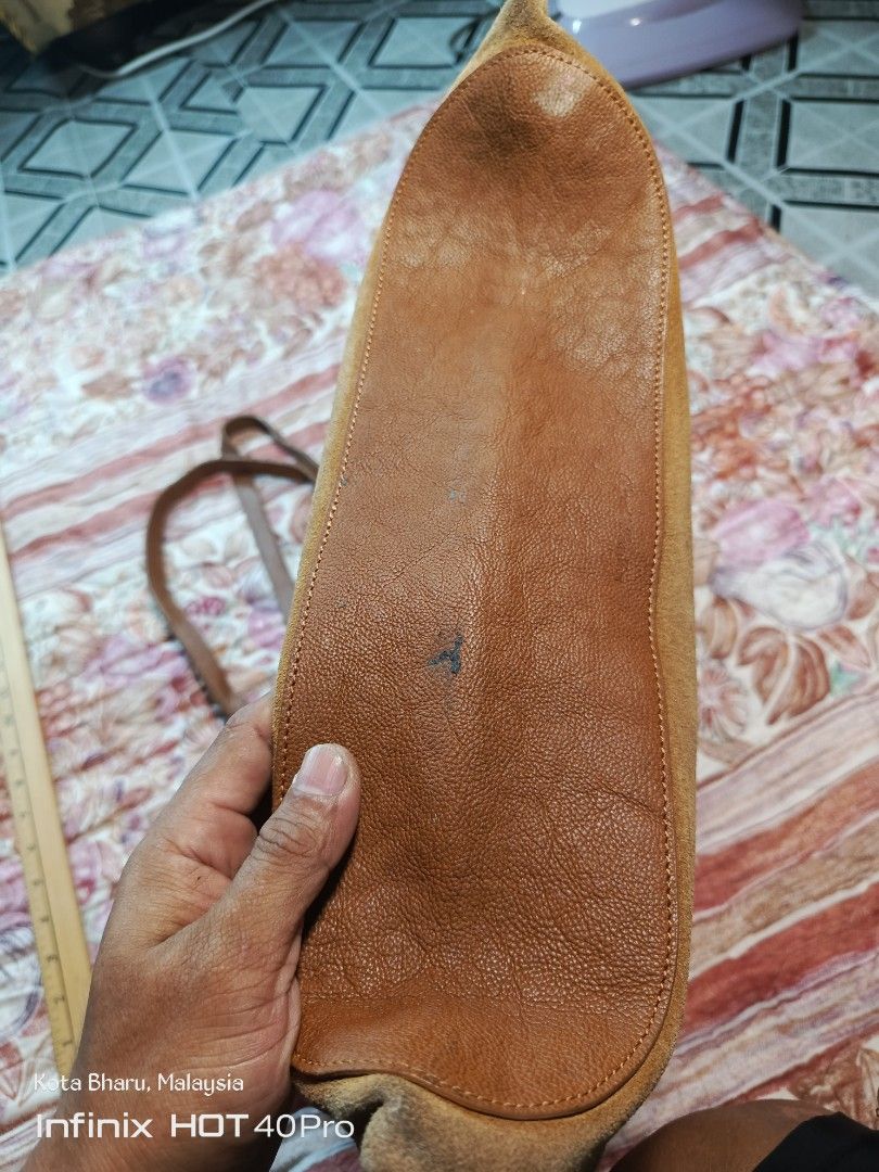 Vintage LongCham (Category: Tote Bags) located in Kuala Lumpur. Submitted by grandturtle_dd5ca3 (Listing ID 1452279110, Image 3). Description: Material: Main body made of genuine tan/brown split suede leather, paired with a matching smooth grain leather base trim and twin shoulder straps. Closure: Features a central metallic snap button/toggle closure strap mechanism typical of vintage Longchamp luggage designs. Dimensions: Measuring alongside th