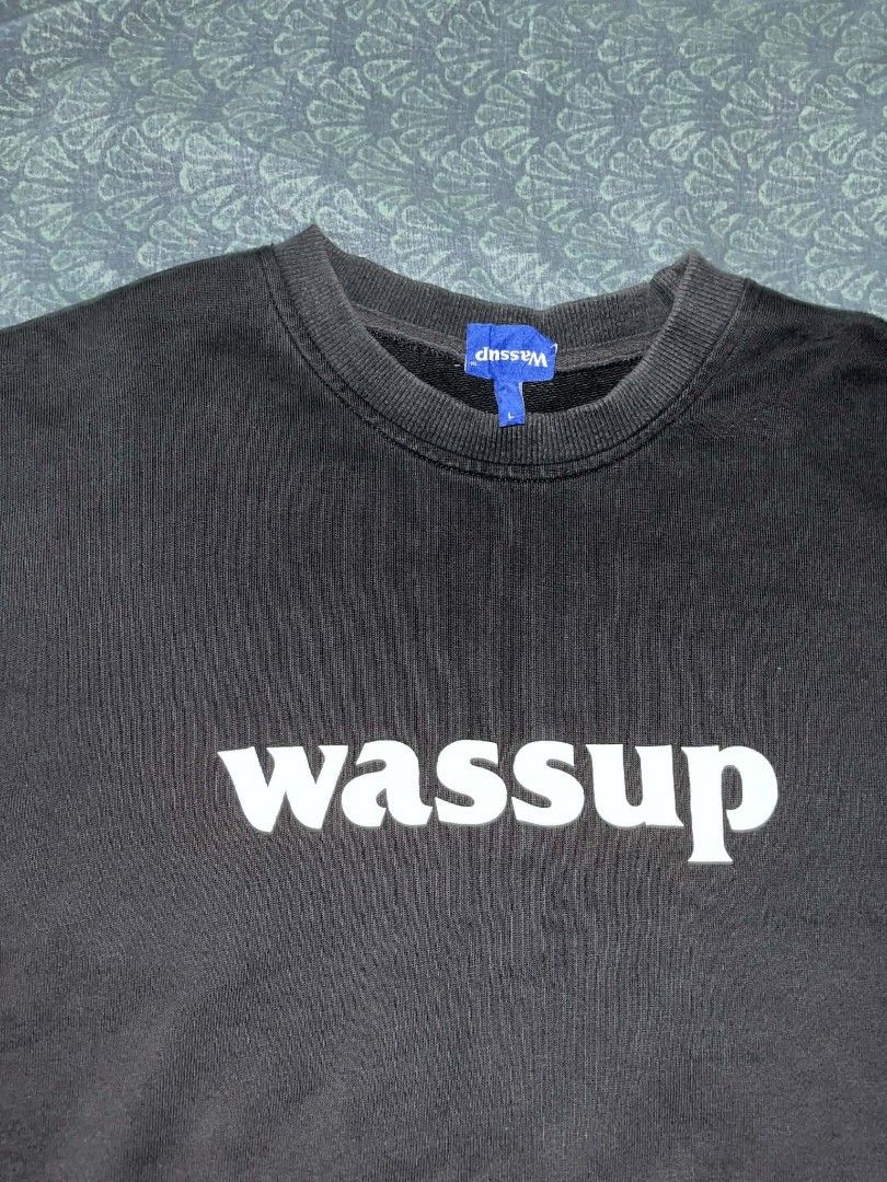 Wassup Black Crewneck Sweatshirt (Category: Coats, Jackets and Outerwear) located in Manila. Submitted by lemlem_10 (Listing ID 1452260238, Image 2). Description: - Black crewneck sweatshirt - Features 'wassup' graphic - Made from 100% cotton - Origin: China - Comfortable and casual design - Ideal for everyday wear.