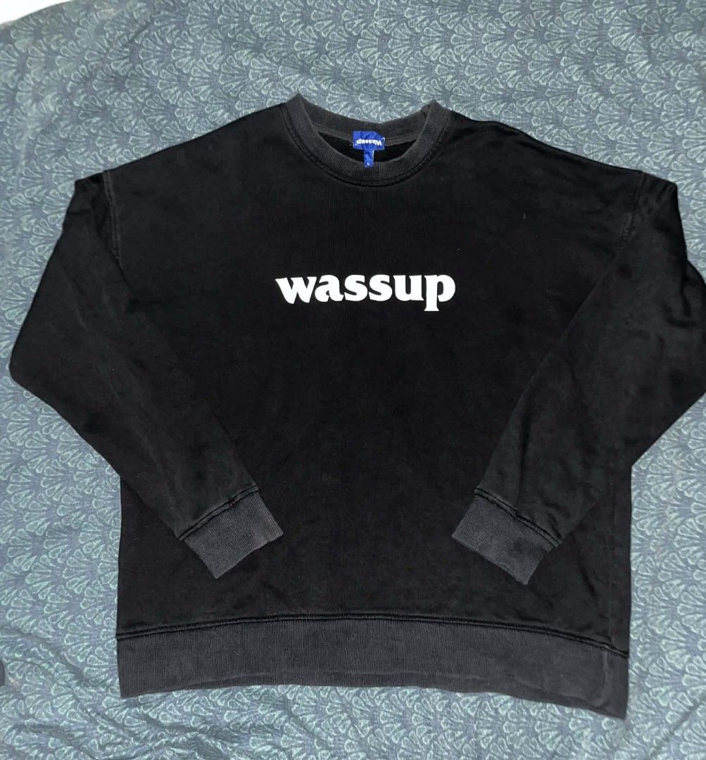 Wassup Black Crewneck Sweatshirt (Category: Coats, Jackets and Outerwear) located in Manila. Submitted by lemlem_10 (Listing ID 1452260238, Image 1). Description: - Black crewneck sweatshirt - Features 'wassup' graphic - Made from 100% cotton - Origin: China - Comfortable and casual design - Ideal for everyday wear.