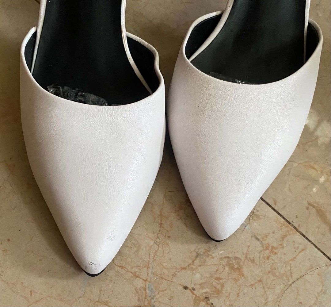 White Pointed Toe Heels with Ankle Strap and Zebra Print Heel (Category: Heels) located in Cebu City. Submitted by arni1 (Listing ID 1452157606, Image 2). Description: - White pointed toe heels - Secure ankle strap - Unique zebra print heel detail - Minor scuffs on toe area - Size: 240 (EU 37.5).