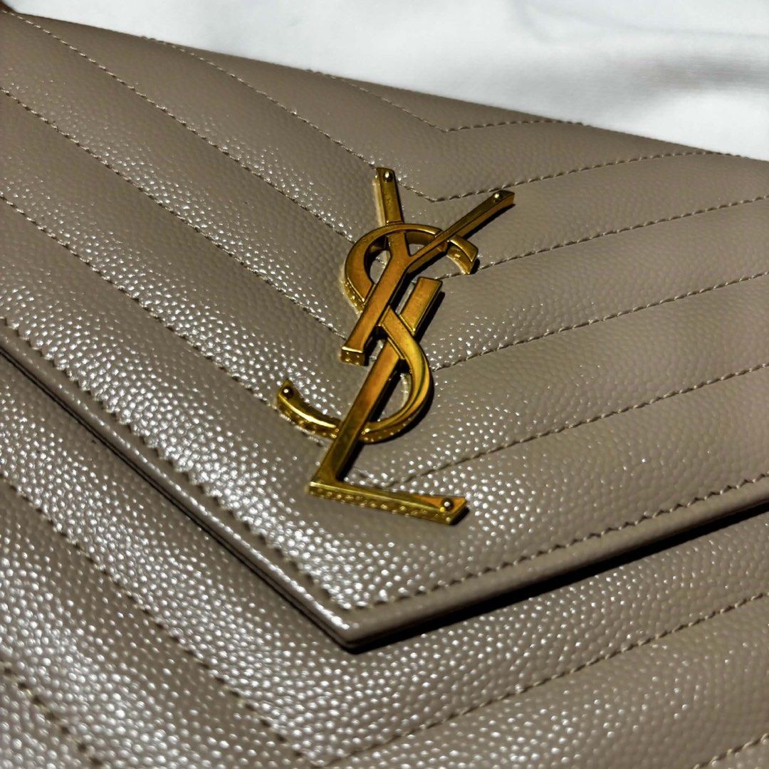 YSL Classic Cassandre Gold Chain Wallet (Category: Luxury Bags & Wallets) located in General Santos City (Dadiangas). Submitted by queenfinds (Listing ID 1452267547, Image 2). Description: Great condition No major flaws With dustbag No other inclusions Guaranteed authentic Saint Laurent Location is Gen. Santos City 64,995 only negotiable DM for more information .