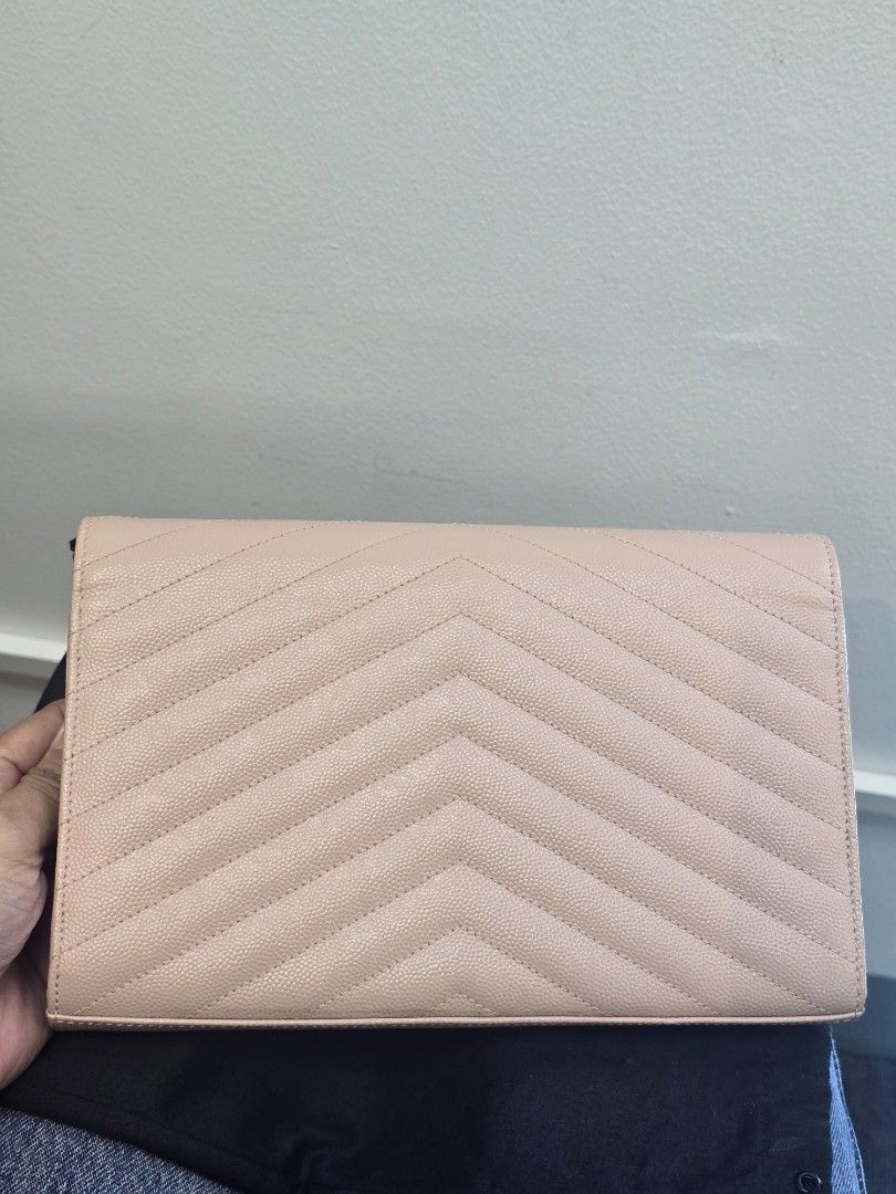YSL Pale Pink Classic Cassandre Wallet on Chain (Category: Luxury Bags & Wallets) located in Taguig. Submitted by mluxeph (Listing ID 1452123730, Image 2). Description: YSL Pale Pink Classic Cassandre Wallet on Chain Material: Grained calfskin leather Stamp: HPF-377828-1222 Interior: Ten card slots, two gusseted compartment, one bills pocket, and one center zip coin pocket Measurements: 8.9”L X 1.5”W X 6”H Handle Drop: 19" Hardware: Gold tone Inc